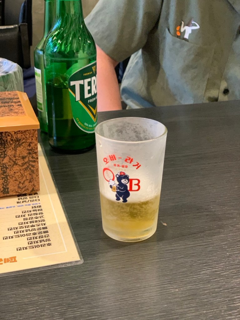 A glass of amber-colored craft beer that complements the savory taste of chicken.