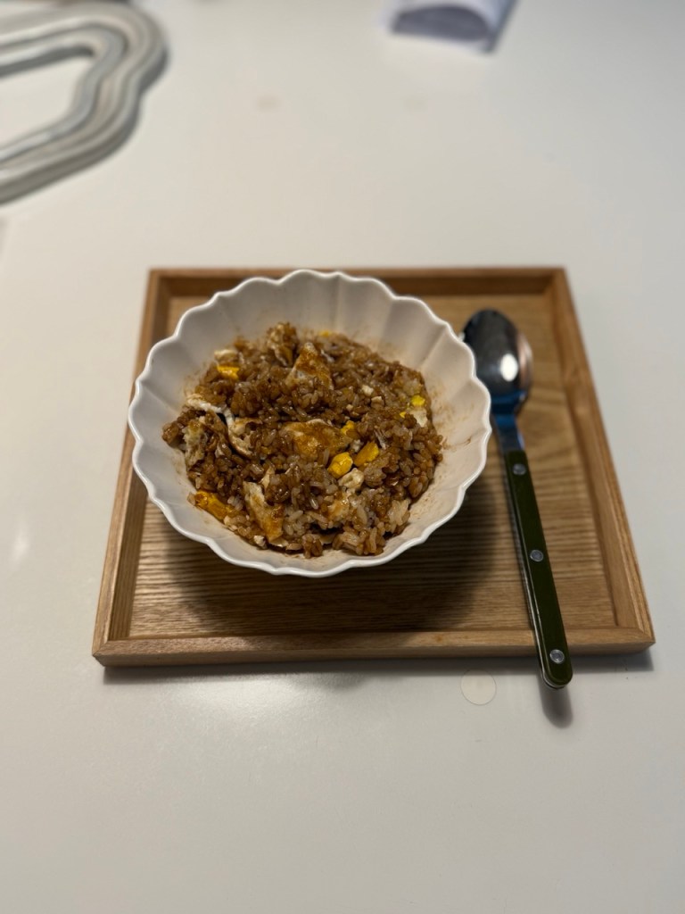 A mixing the egg and rice for a yummy breakfast.
