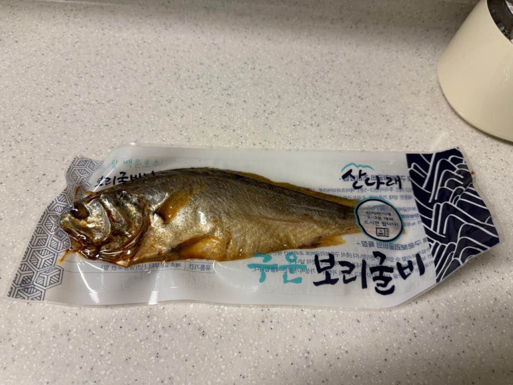 Aesthetic shot of a vacuum-sealed dried corvina ready for the microwave.