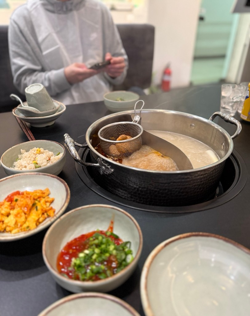 The red mala bear slowly melting into the spicy broth as it heats up.