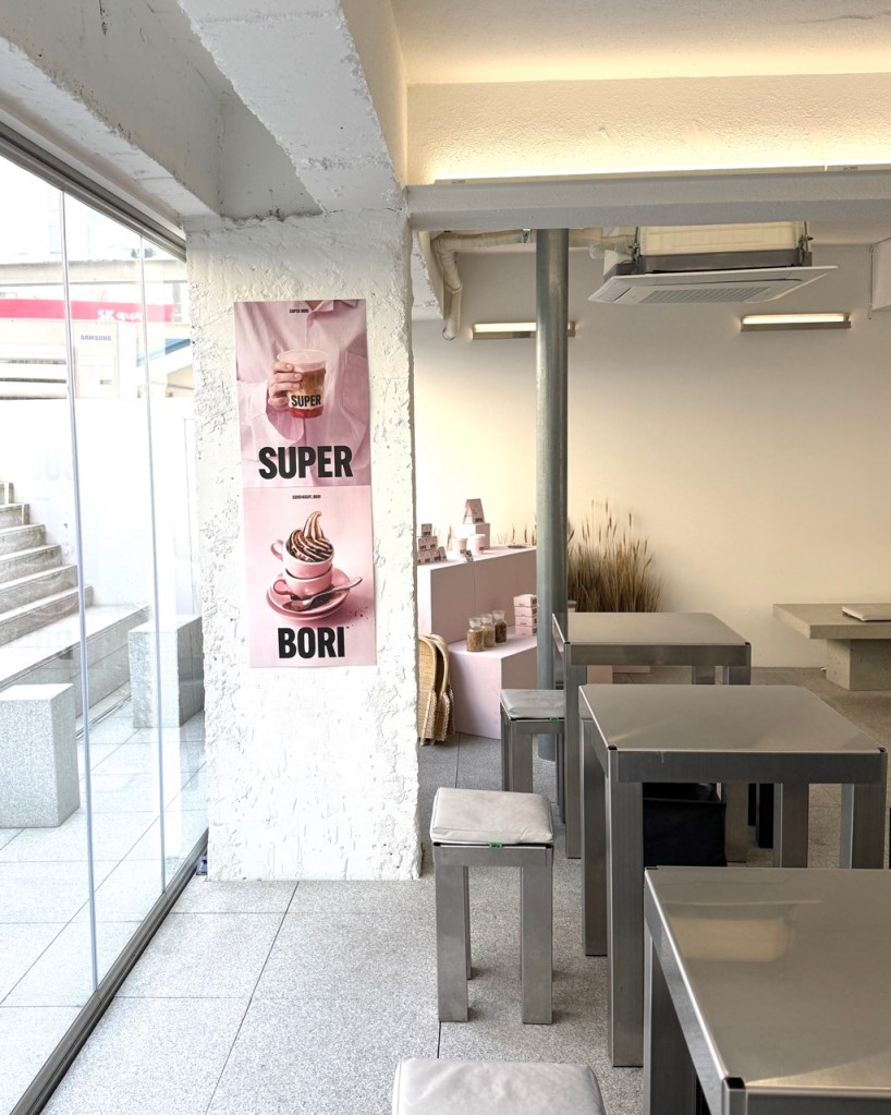The stylish interior of the cafe decorated with the brand's signature green color.