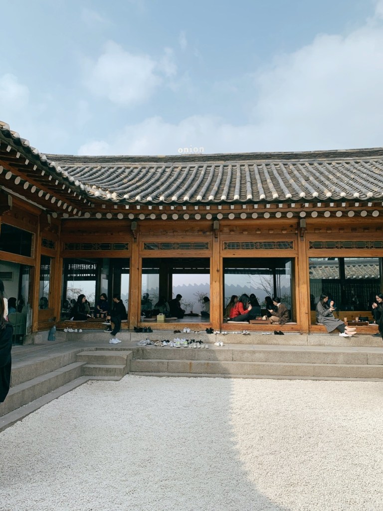 The open courtyard of the cafe blending traditional and modern architecture.