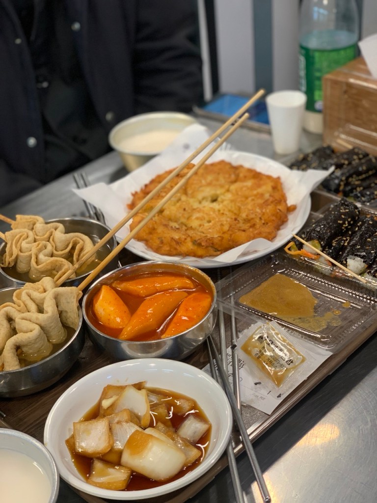 Glossy and chewy tteokbokki coated in a thick, sweet, and spicy gochujang sauce.