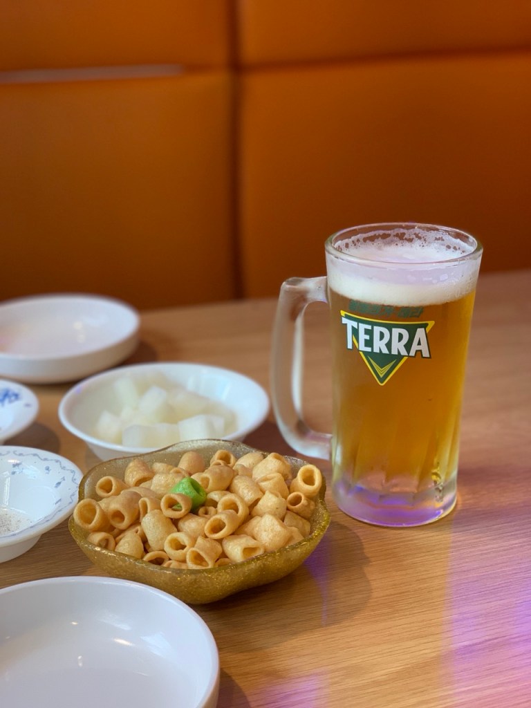 A representative shot of a cold glass of beer paired perfectly with fried chicken.