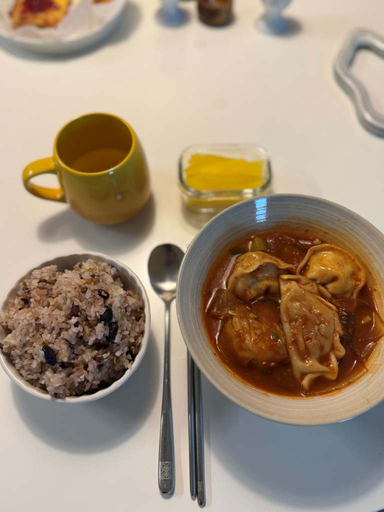A big pot of homemade spicy dumpling stew with glass noodles.