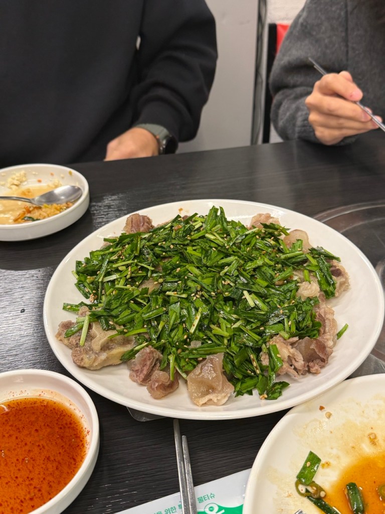 A sequence of diverse Korean tapas and dishes served one after another.