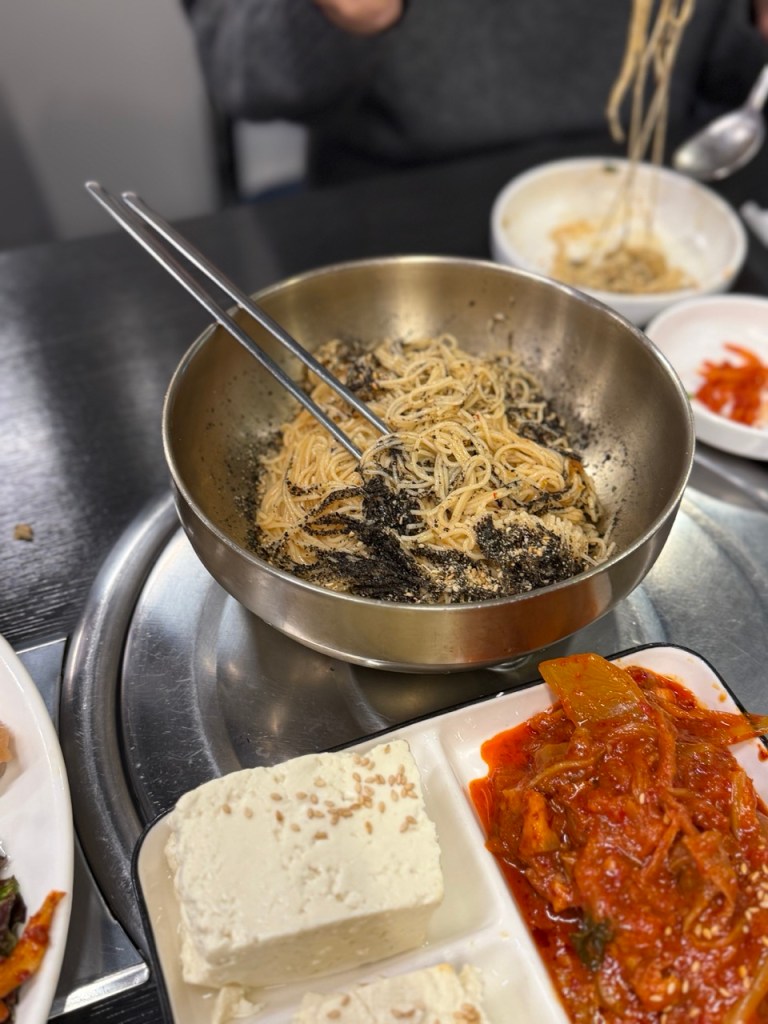 A rich collection of different Korean snacks and side dishes for pairing with drinks.