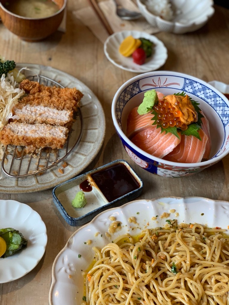 Neat and minimalist Japanese tableware set on a wooden table.