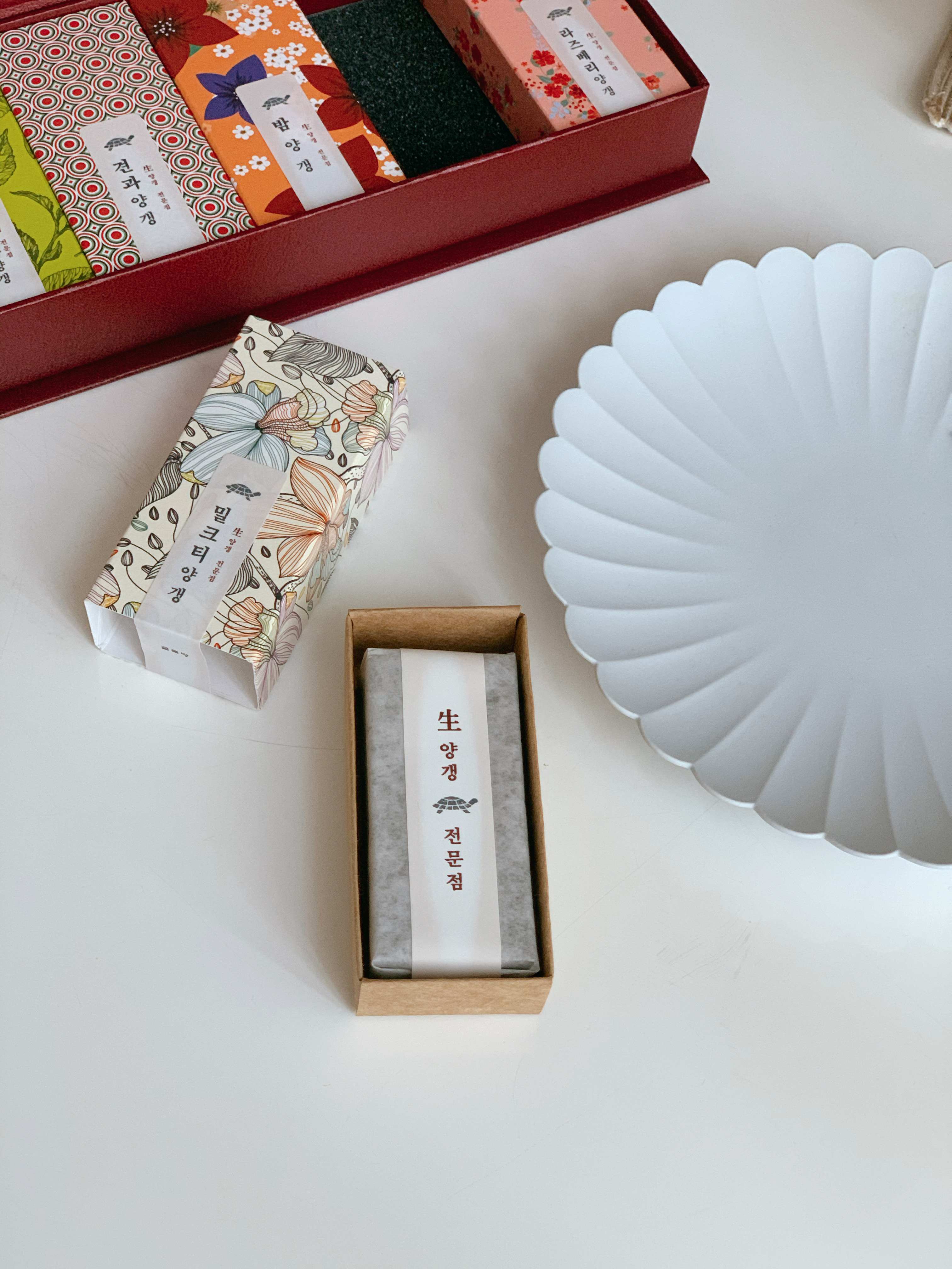 A clean-cut slice of smooth and dense red bean jelly (Yanggaeng).