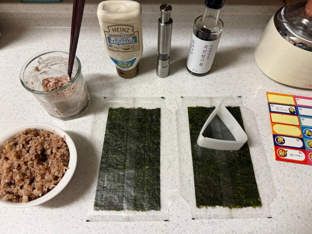Shaping the rice using a triangle-shaped mold.