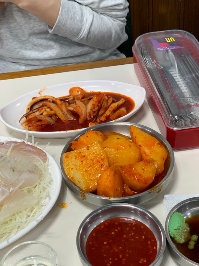 Sweet and salty braised potatoes and other traditional Korean side dishes.