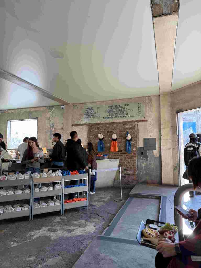 The raw, unfinished concrete walls and vintage interior design of the cafe.