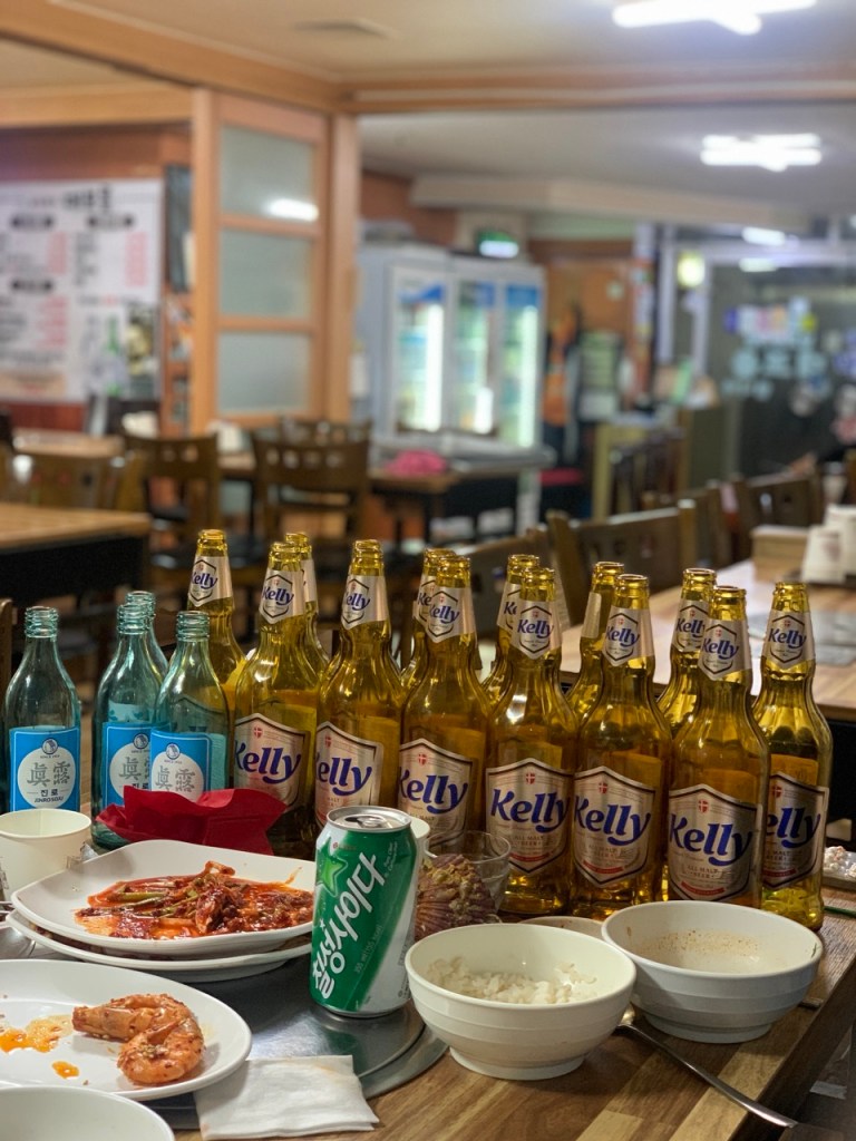 Samhap platter served with traditional Korean drinks in a cozy atmosphere.