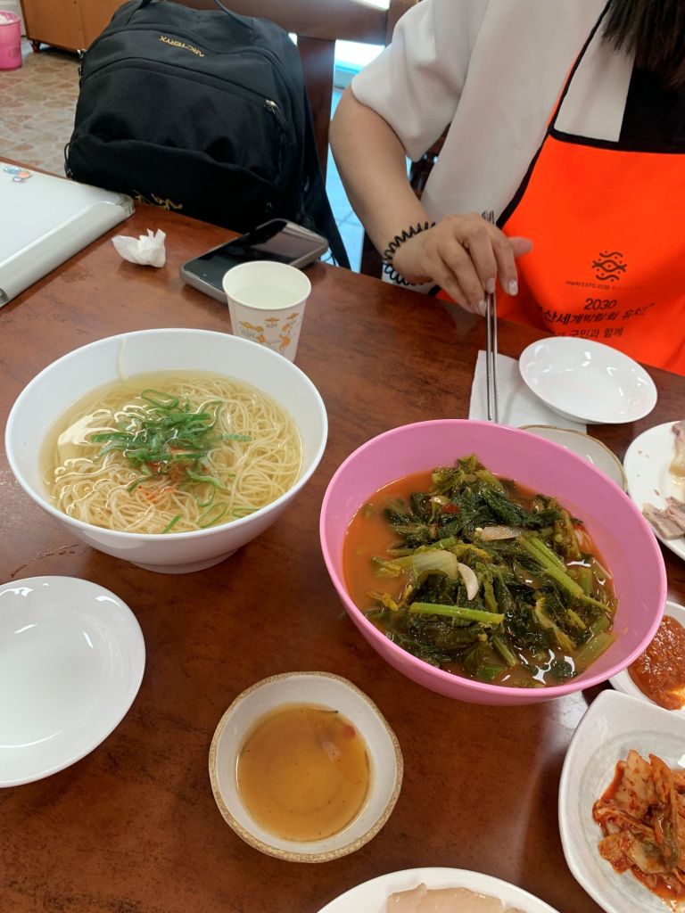 The busy and warm atmosphere inside the restaurant filled with loyal local diners.