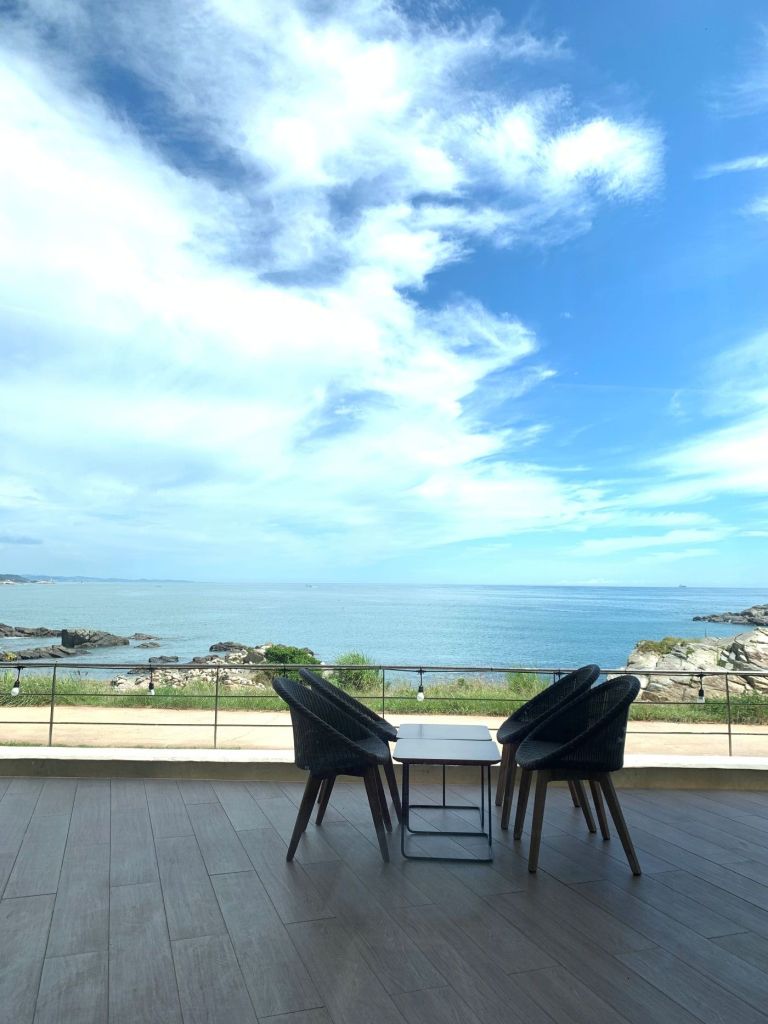 A stunning outdoor terrace seating with an unobstructed view of the Busan ocean.
