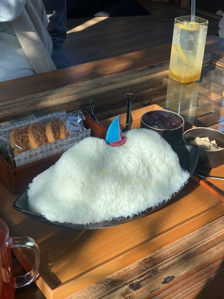 An aesthetic wooden tray featuring colorful Korean bing-su