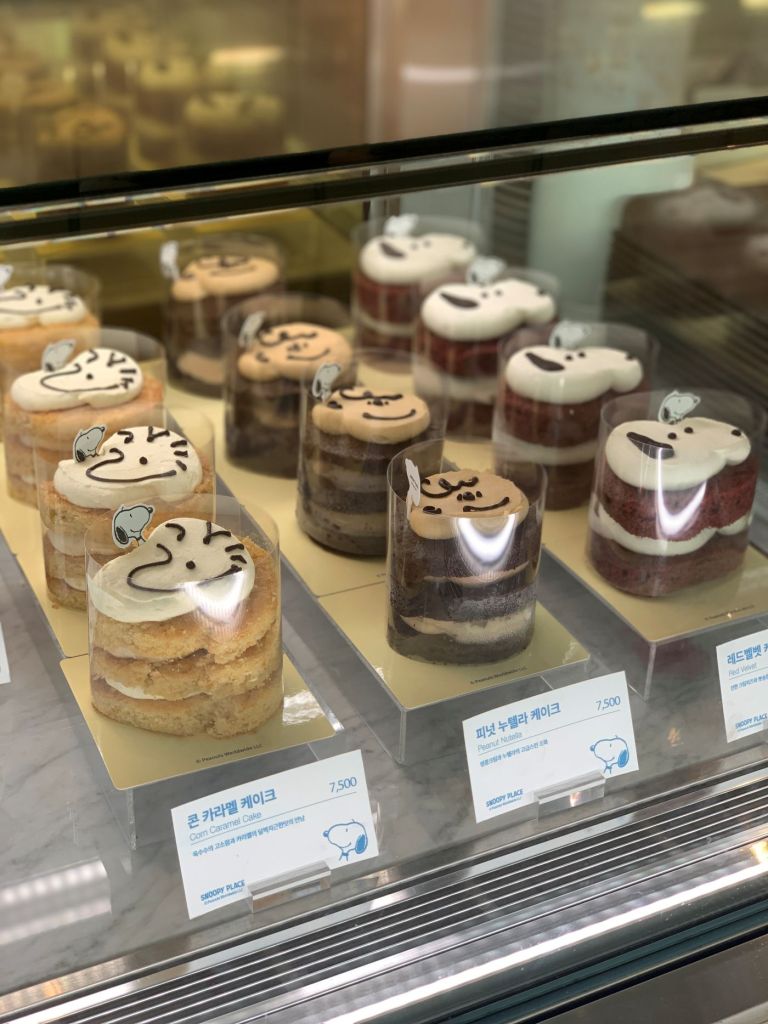 Adorable red velvet cakes and brownies shaped like Snoopy and Charlie Brown.