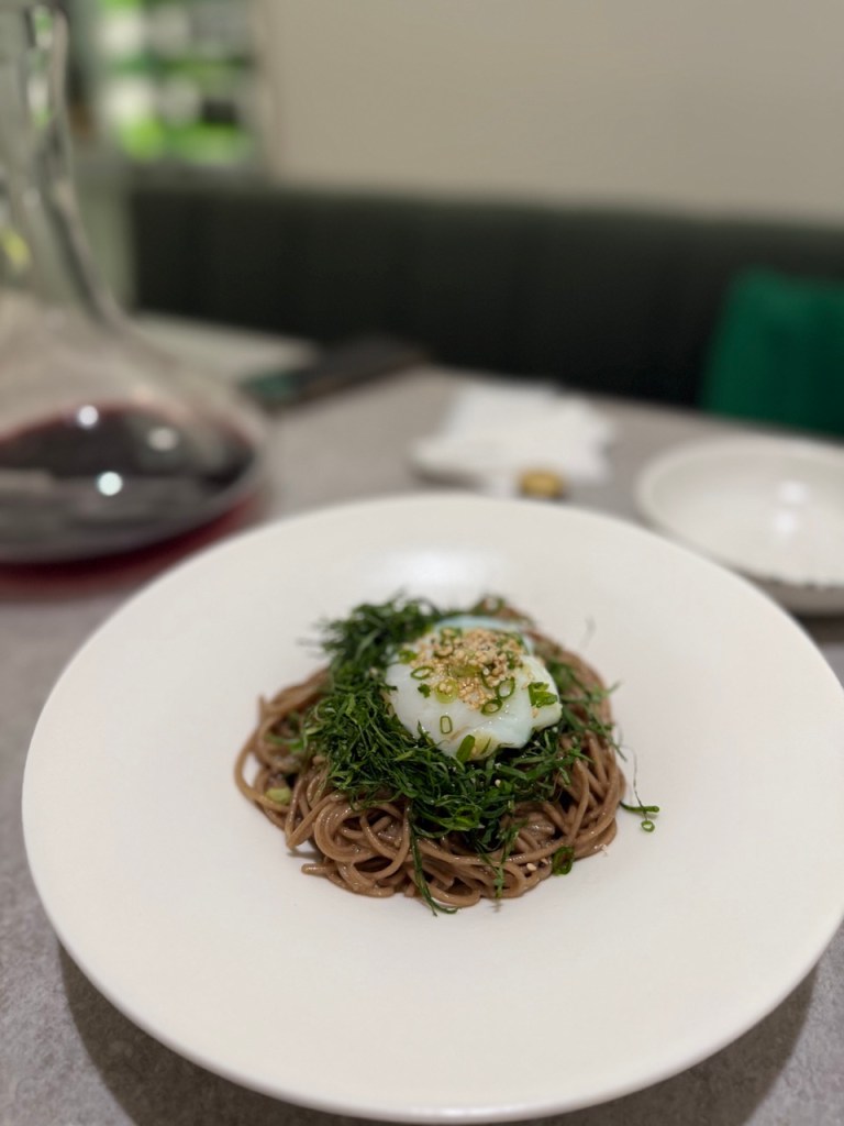Aesthetic and minimalist plating of the cold perilla oil buckwheat noodles at MOWa.