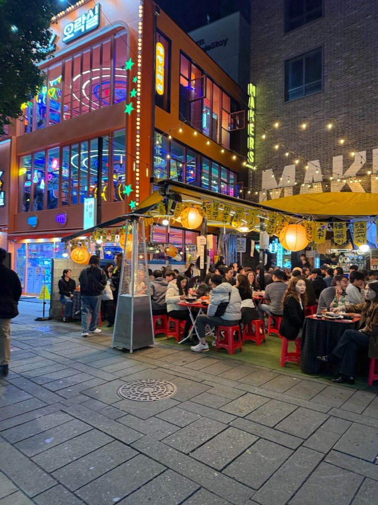 The warm and nostalgic glow of the traditional street stall tents in Seoul.