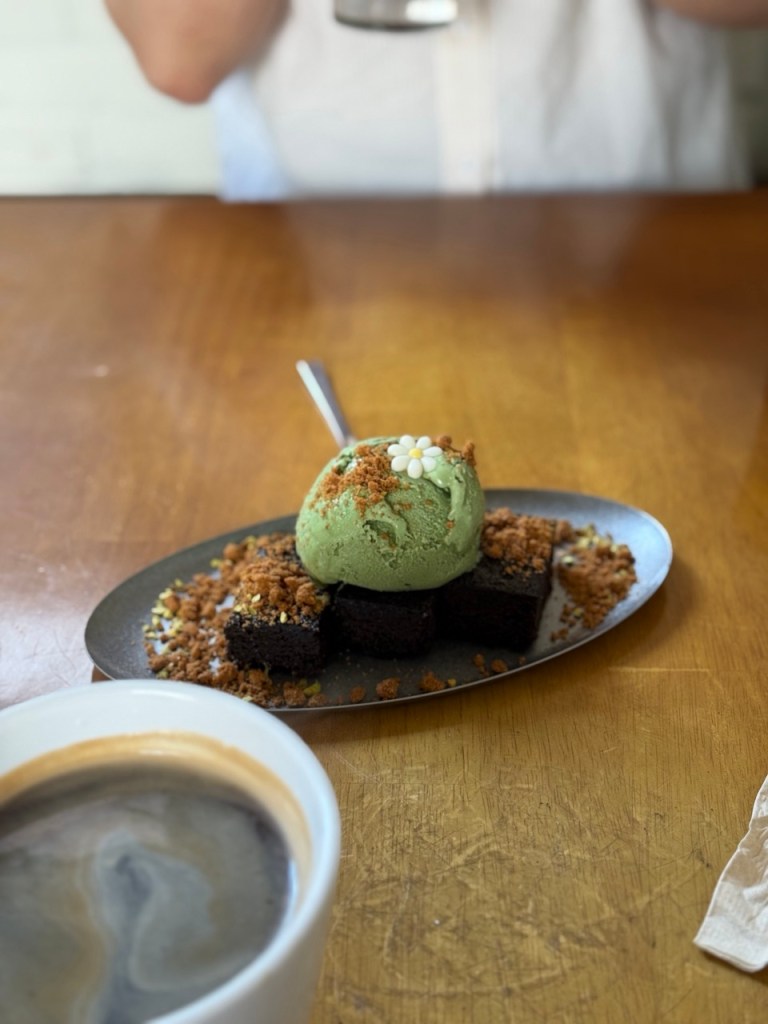 A dense and creamy scoop of premium matcha ice cream with earthy undertones.