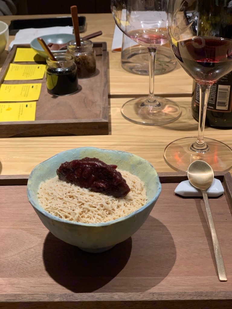 Fluffy snow-like shaved ice topped with sweet red beans and rice cakes.