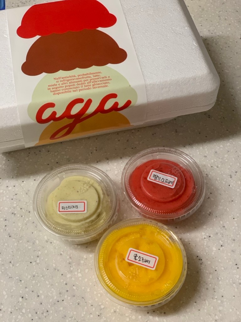 The signature service showing an adorable extra mini-scoop on a regular cup.