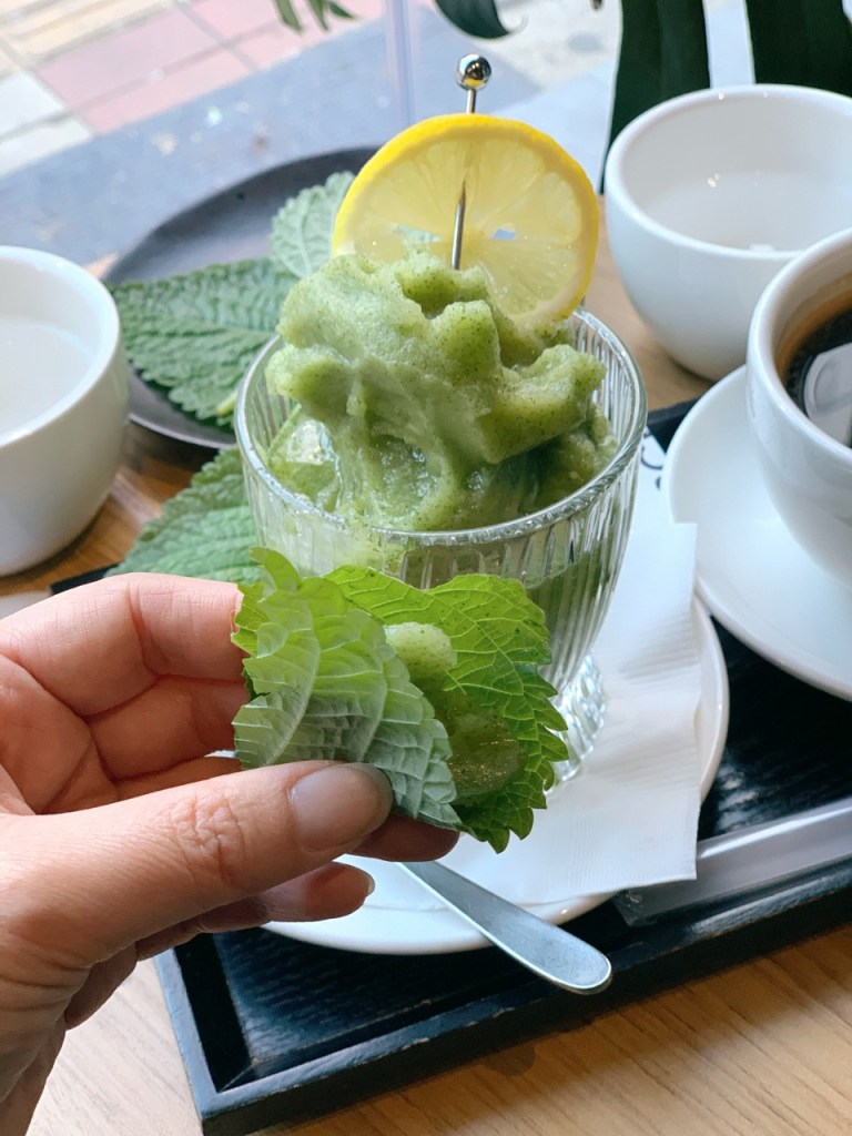 Close-up of the smooth, emerald-green texture made from fresh perilla leaves.