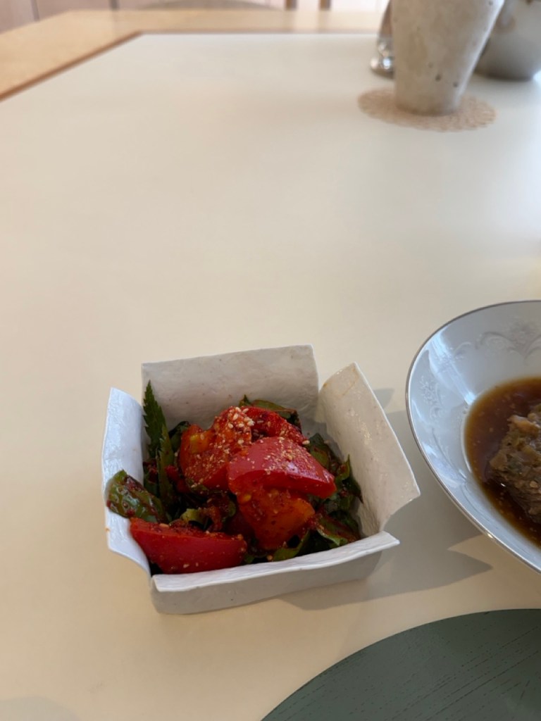An artistically presented Korean fusion dish, showcasing Babette's unique and innovative reinterpretation of traditional flavors.