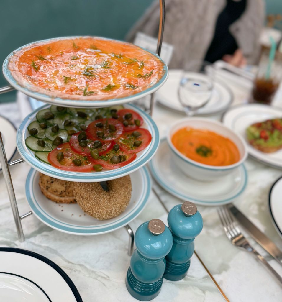 The iconic 3-tier brunch tower at Sadelle's Seoul, featuring premium smoked salmon, fresh tomatoes, capers, and cucumbers.