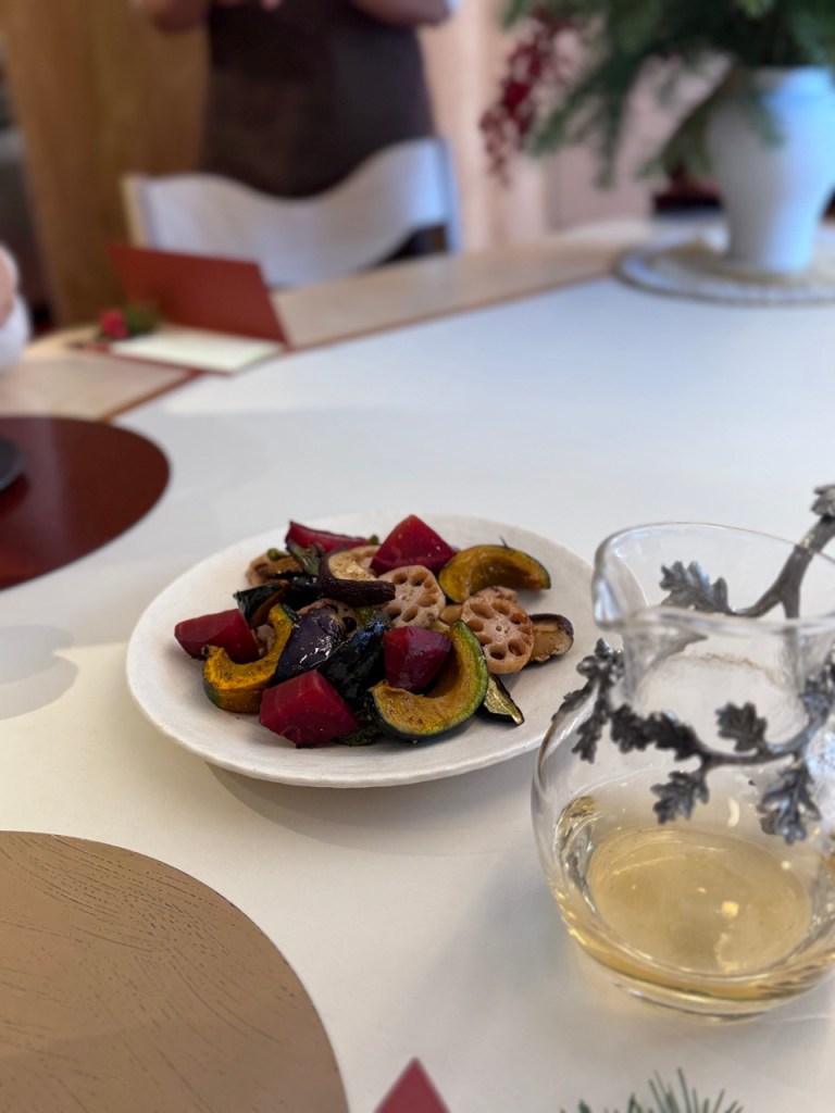 Perfectly charred seasonal vegetables, including root veggies and mushrooms, enhanced by smoky charcoal flavors.