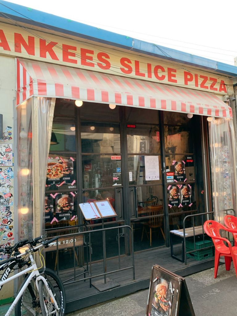 The vintage industrial-style storefront of Yankee Burger located in the heart of Mullae Art Village.