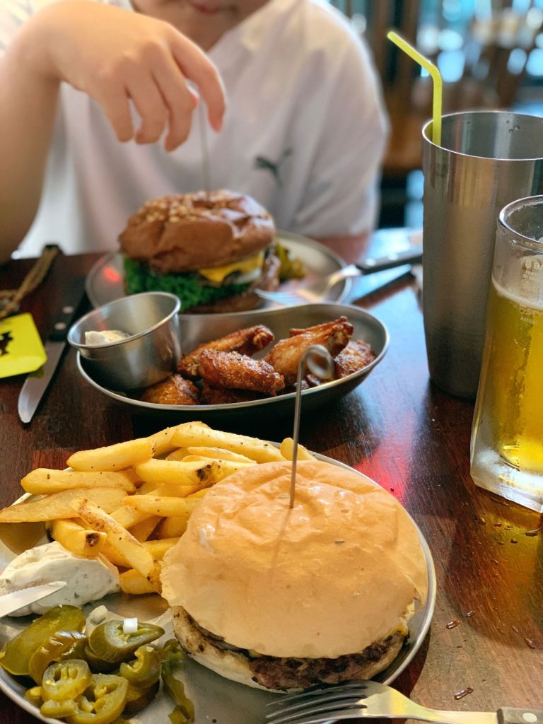 A delicious set of a classic handmade cheeseburger served with crispy golden french fries at Yankee Burger.
