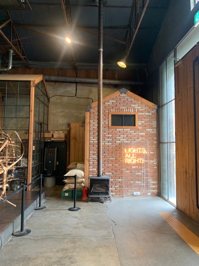 The grand, vintage red-brick exterior and industrial steel entrance of Daelim Changgo gallery cafe in Seongsu-dong.