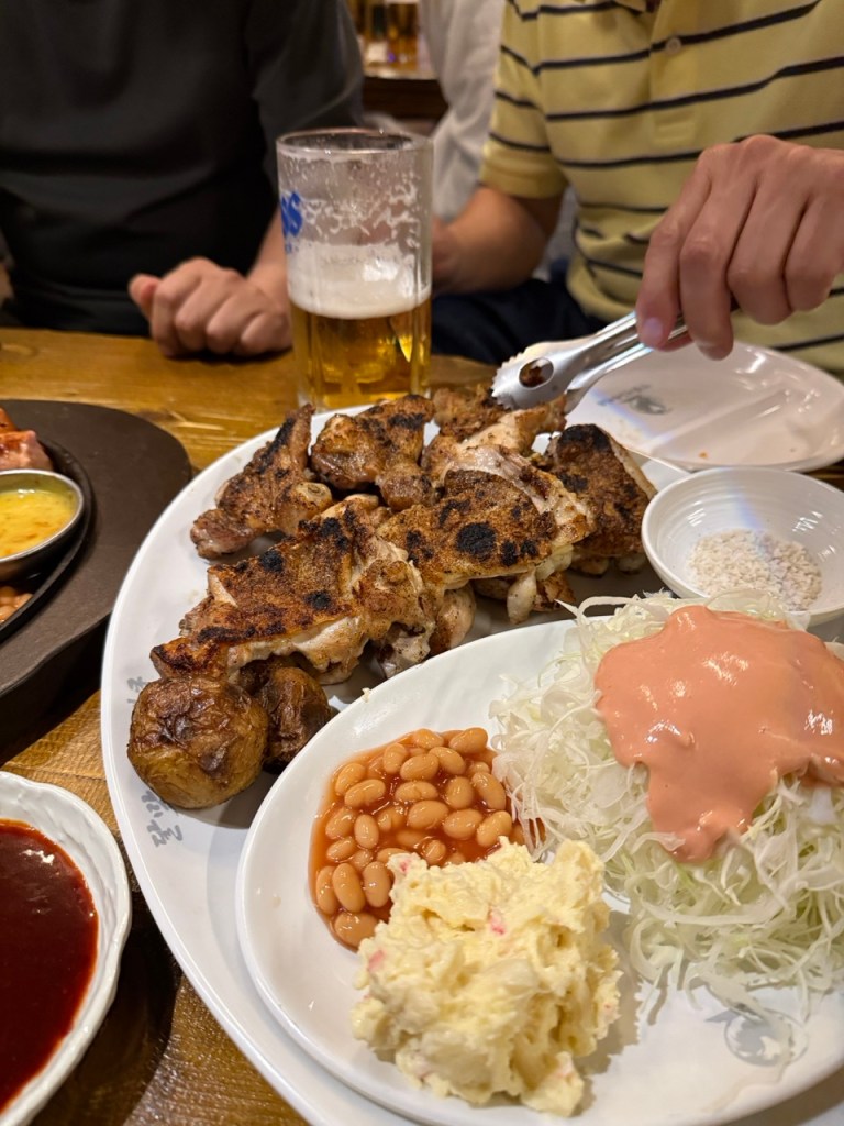 A sizzling platter of tender, charcoal-grilled K-chicken barbecue slathered in a glossy, sweet and spicy signature glaze.