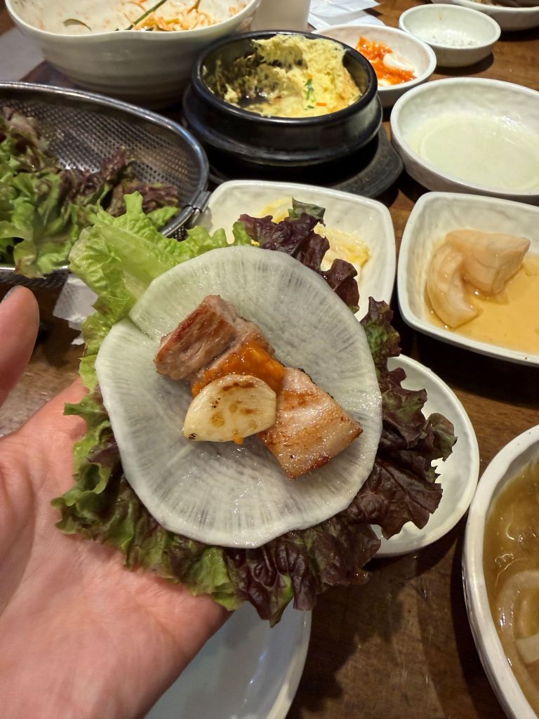 A refreshing and crunchy wrap variety using a thin, translucent sheet of sweet and sour Korean pickled radish (Mussam)