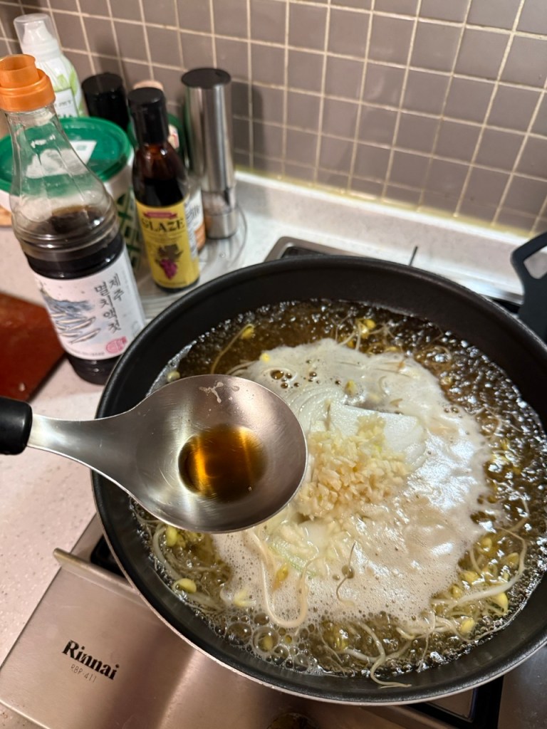 Adding a spoonful of traditional Korean salted shrimp (Saeujeot) to elevate the broth's clean and salty umami profile.
