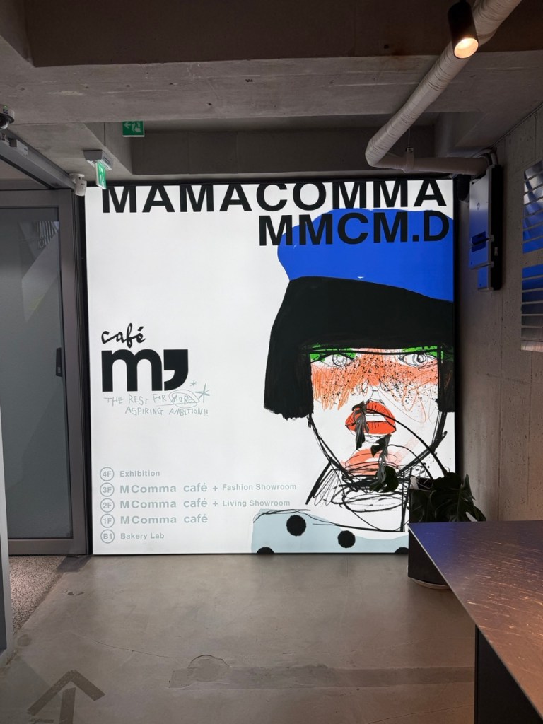 A high-satisfaction look at the striking modern art painting by illustrator Mamacomma hanging inside Cafe M Comma.