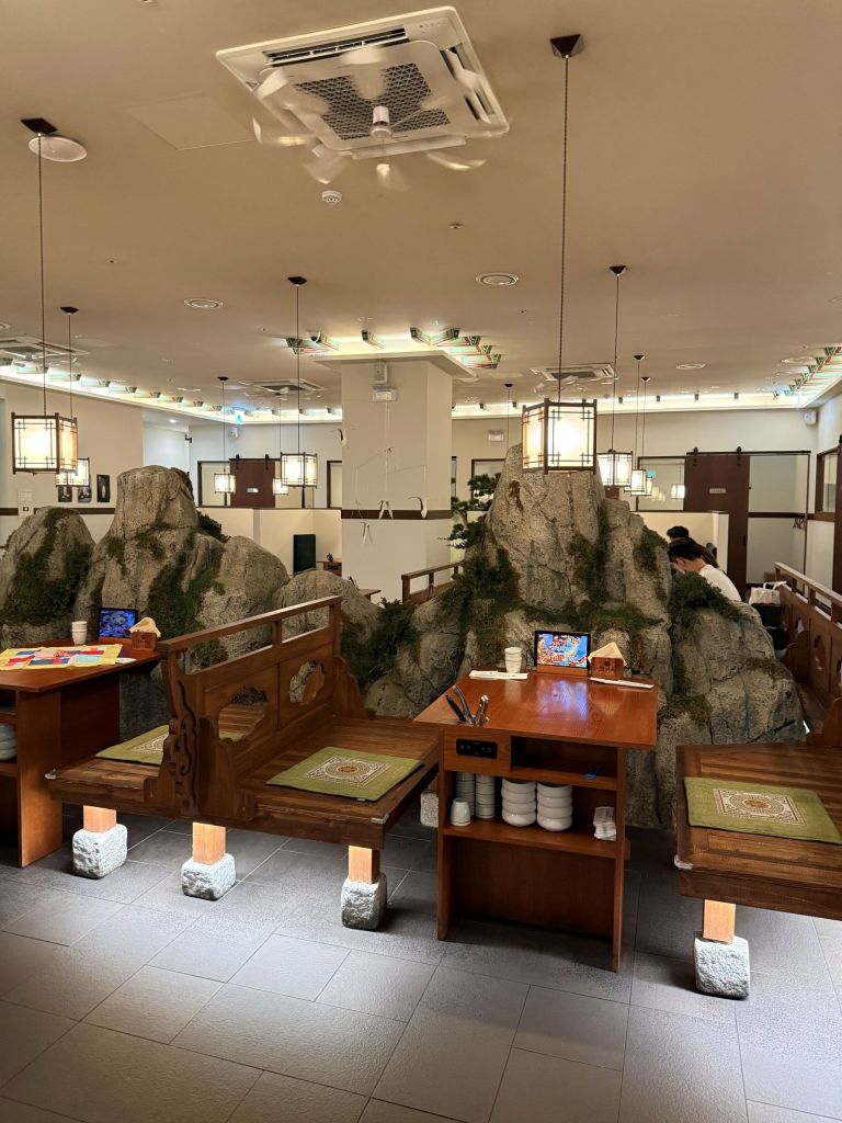 The spacious, upscale contemporary dining room at Hanmiok featuring premium tabletop griddle setups.