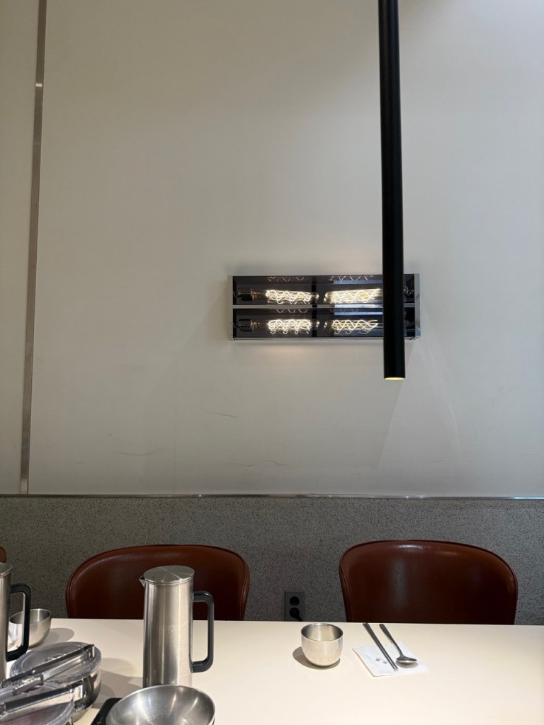 The spacious, upscale, and modern industrial interior design of Wongiok restaurant in Seongsu-dong.