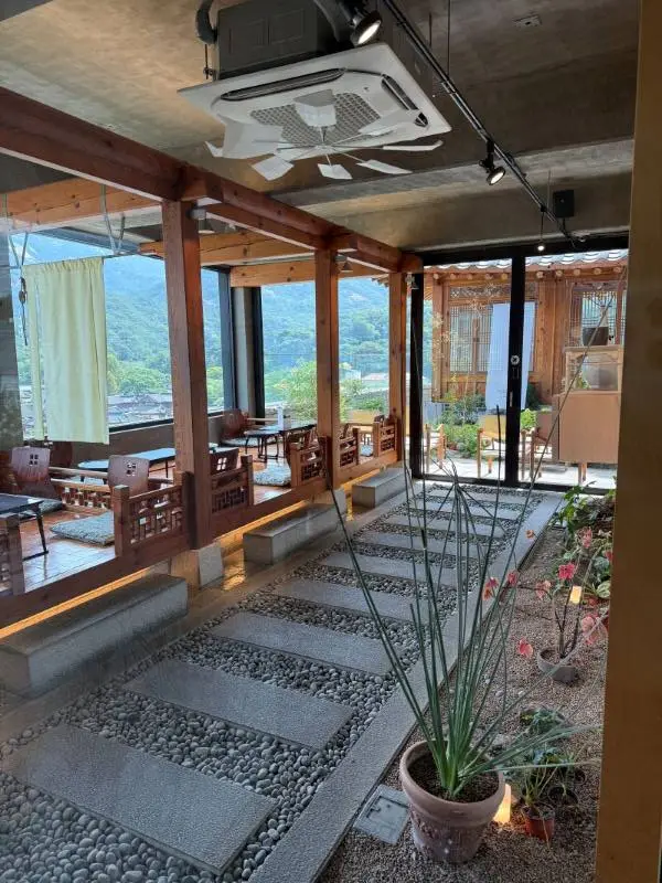 A beautiful close-up highlighting the clean interior design blending modern wood aesthetics with traditional Hanok charm.