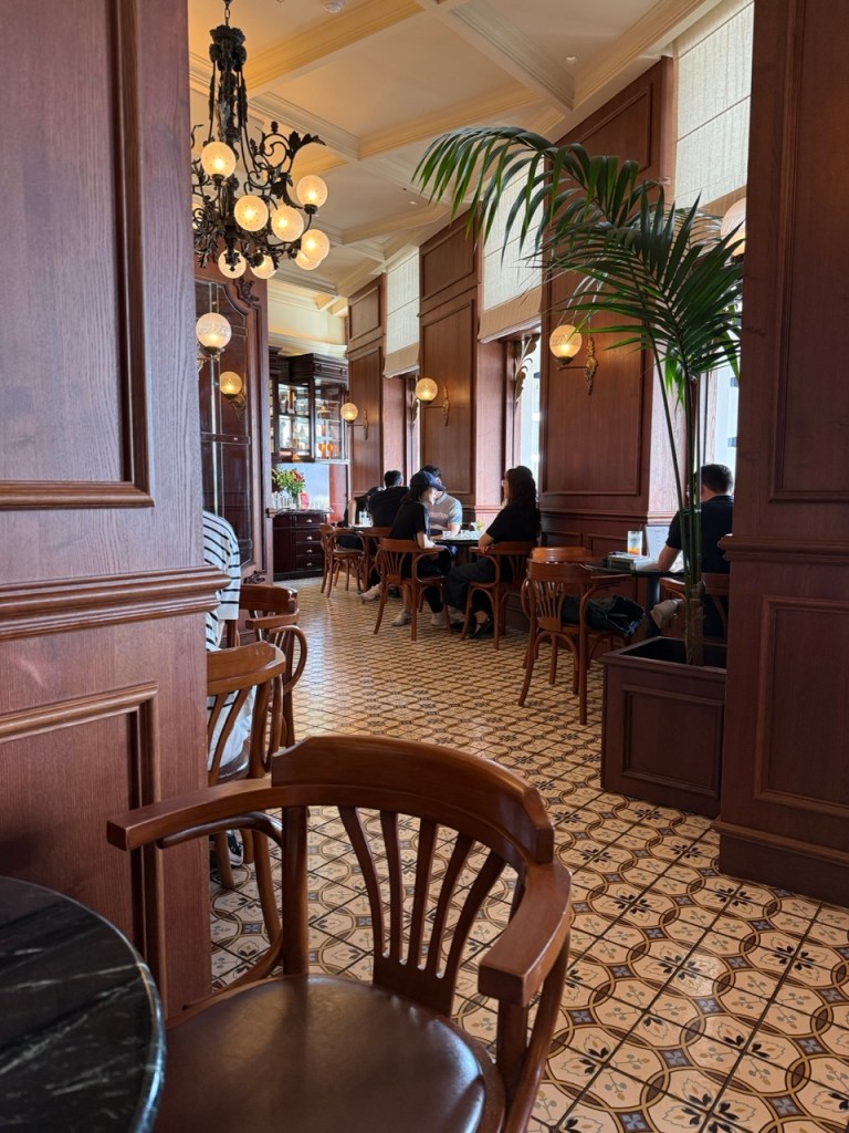 A beautiful close-up highlighting natural stone counters and warm wooden interior accents in Cafe ALMA.
