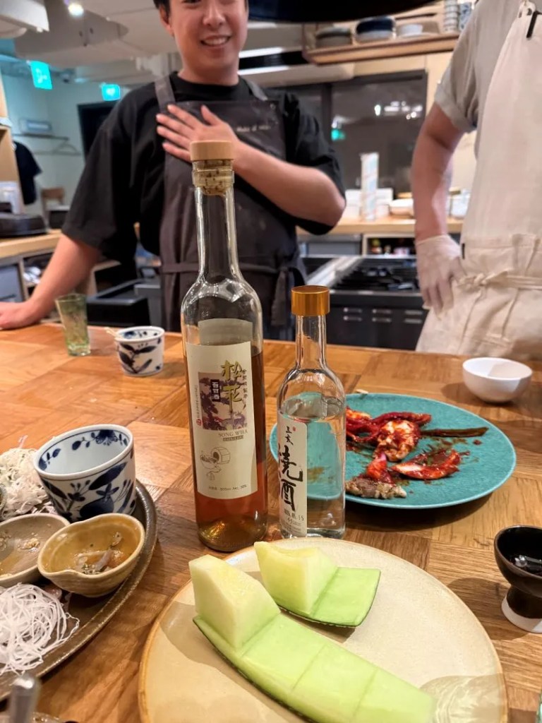 A warm lifestyle snapshot capturing a sweet traditional Korean dessert and tea pairing served at the end of the course.
